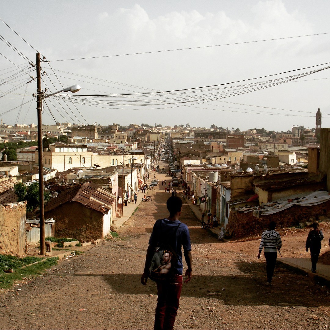 A wide view down a hillside street through the Abashawl neighborhood